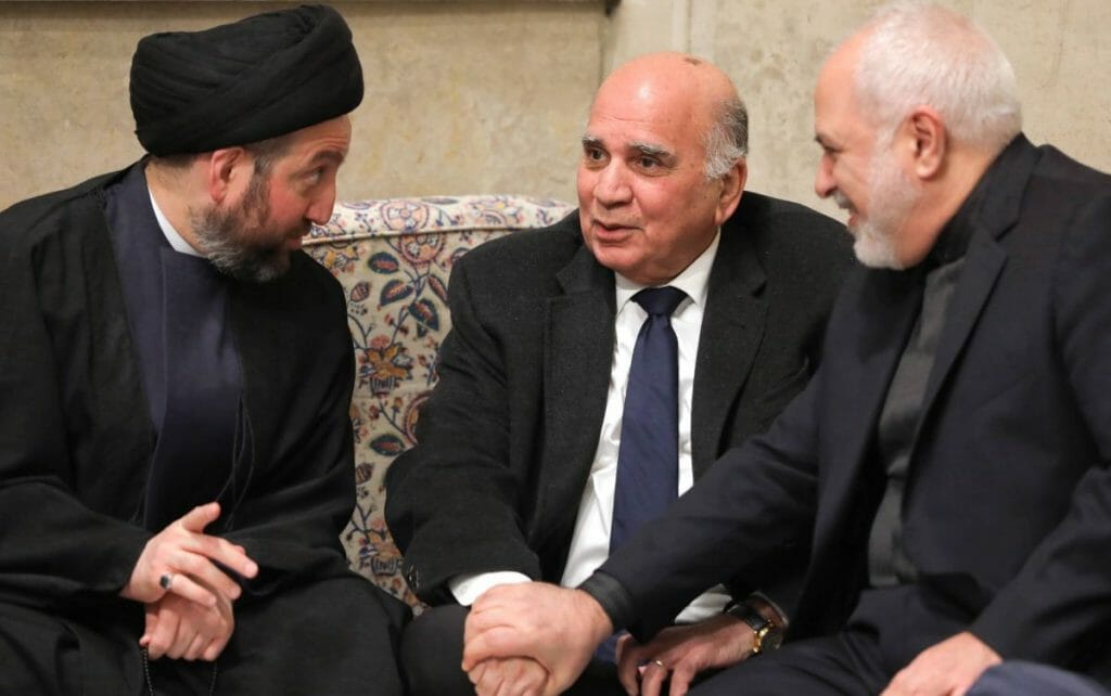 Vorsitzender der Hashd al Shaabi Faleh al-Fayyad (mi.) mit Irans Außenminister Mohammad Javad Zarif (re.)