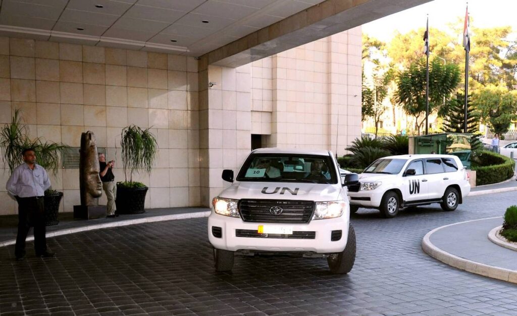 OPCW-Ermittler in Damaskus nach dem Chemiewaffeneinsatz in Ost-Ghouta 2013. (© imago images/Xinhua)